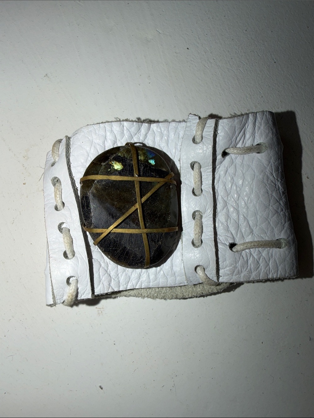White Leather Wristband Cuff with Dark Stone Accent